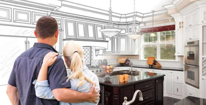 couple facing life size sketch of kitchen